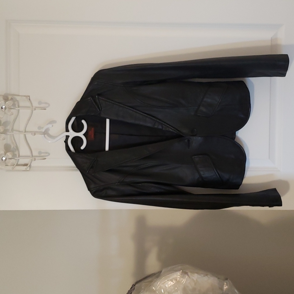 Black suit leather jacket. Brand is Danier . Size xxs .